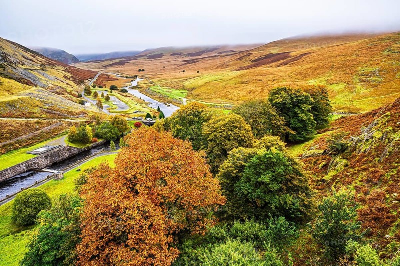 Autumn colors over Claerwen Dam, Claerwen Valley, Elan Valley Reservoir, Rhayader, Powys, Wales, UK