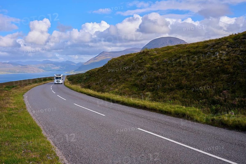A motorhome on a quiet road in rolling countryside, Little Loch Broom, view point, Durnamuck, Garve, Scotland, United Kingdom, Great Britain