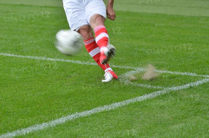 Player knicks the ball from the corner, intentional blur in Lubin, Poland