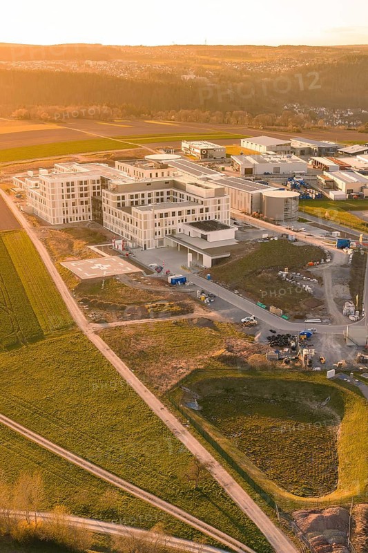 Modern buildings in a scenic setting at sunset, with focus on construction, new hospital at the Verbund Südwest Clinic, Calw, Germany