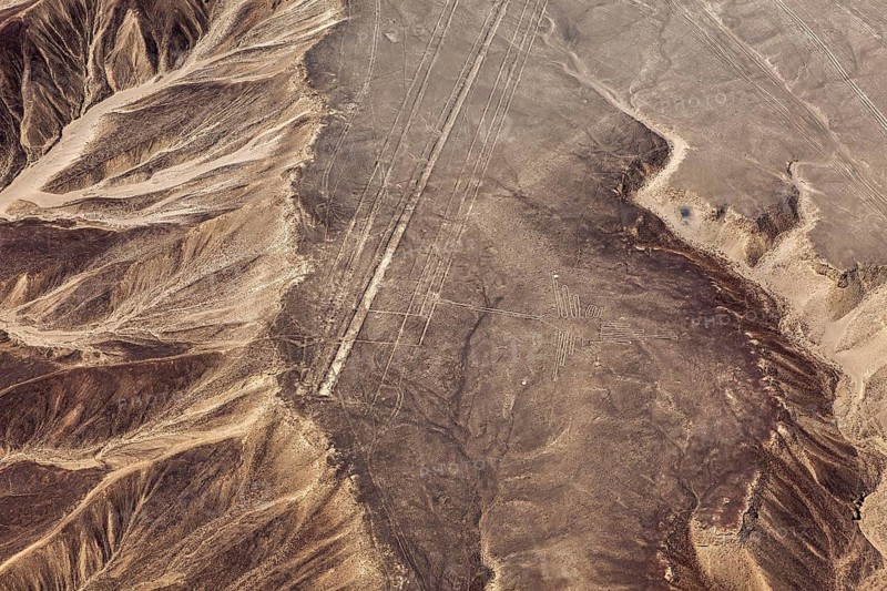 Geoglyphs and different textures of a desert landscape from the air, The geoglyphs and images in the desert near Nasca and Palpa in Peru