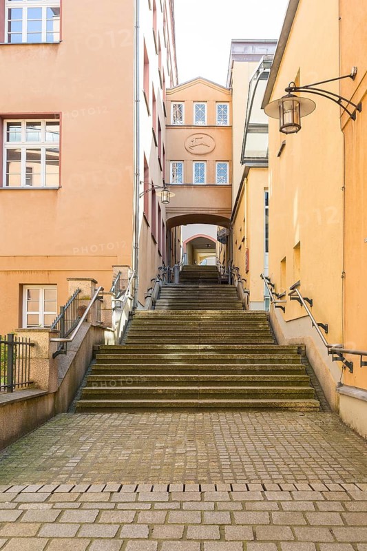 Archway at the New Town Hall with stairs at the portico, the passageway to the AltmarktLichtenstein, Saxony, Germany