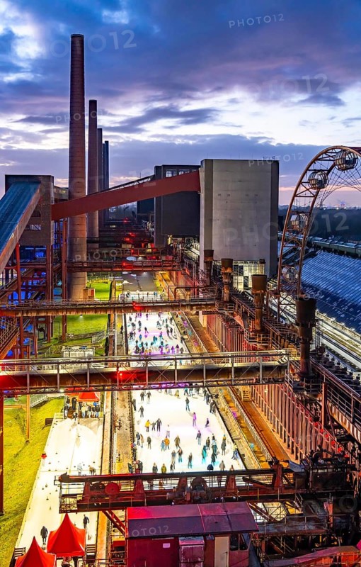 The ice rink at the Zollverein coking plant, UNESCO World Heritage Zollverein Coal Mine Industrial Complex, 150 metres long, against the backdrop of the coke ovens, formerly the largest coking plant in the world, Essen, North Rhine-Westphalia, Germany
