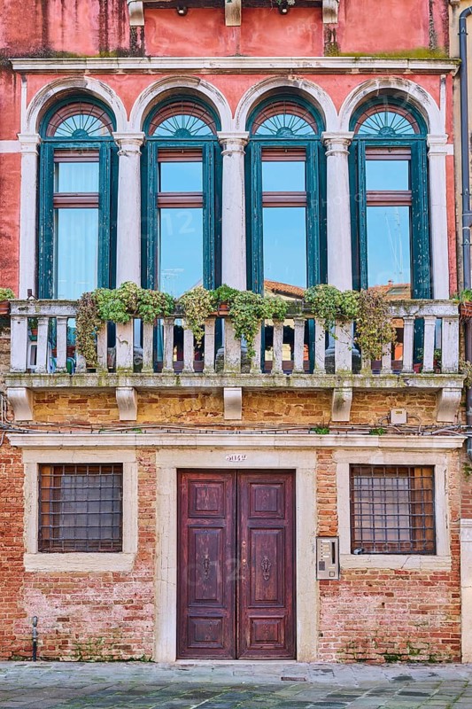 Front side of an old house on 'Campo santa margherita' town square in Venice on a sunny day in winter, Italy