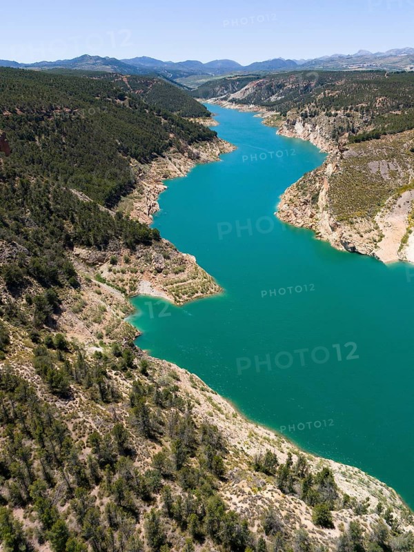 Aerial view of a river meandering through forested mountains with calm blue water, aerial view, reservoir, Embalse de Francisco Abellan, Fardes River, La Peza, Granada, Andalusia, Spain