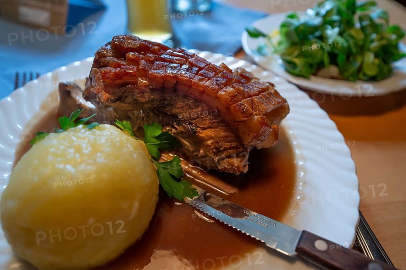 Schäuferle, pork shoulder with dumpling and sauce and salad, served in a Franconian tavern, Franconia, Bavaria, Germany