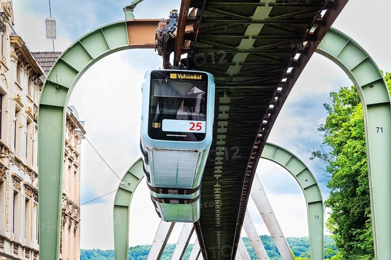 The Wuppertal suspension railway runs through Vohwinkel in front of buildings from the Wilhelminian era near the Hammerstein stop in Wuppertal, Germany