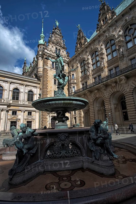 Hygieia fountain in the courtyard of Hamburg City Hall under a blue sky, Hamburg, Germany