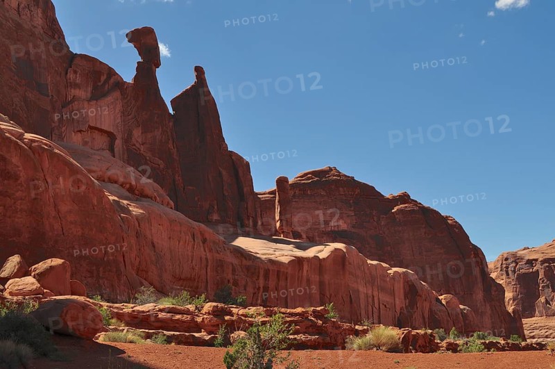 Impressive rock formations in a dry desert under blue sky, Arches National Park, Utah, USA
