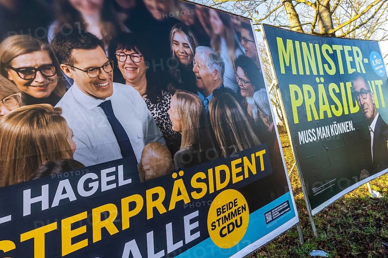 2026 state election in Baden-Württemberg. Election posters at a crossroads in Fellbach. Large posters of the top candidates from CDU and Die Grünen side by side. Fellbach, Baden-Württemberg, Germany