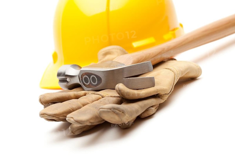 Yellow Hard Hat, Gloves and Hammer Isolated on White
