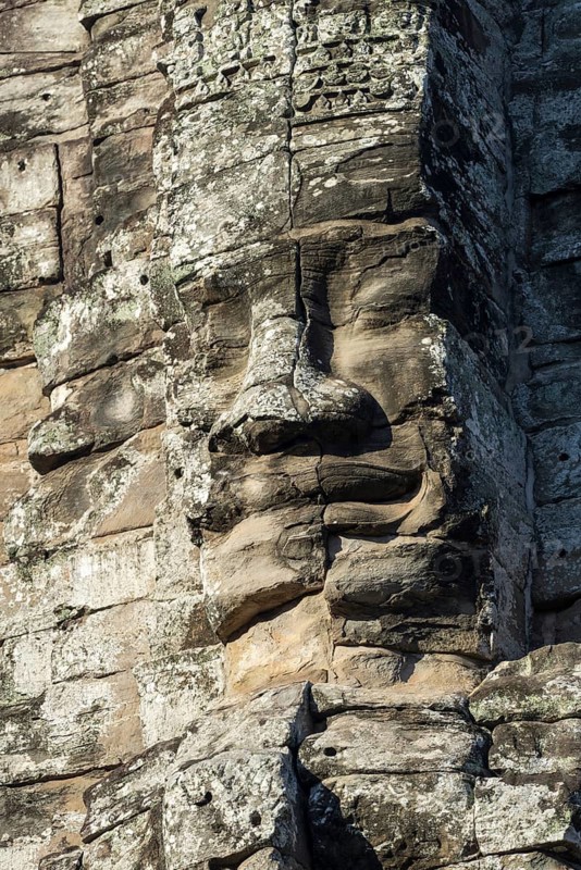 Giant stone-carved face of the Bodhisattva Lokeshvara, also known as Avalokiteshvara, Bayon Temple, Angkor Thom, UNESCO World Heritage Site, Angkor Wat, Siem Reap, Cambodia