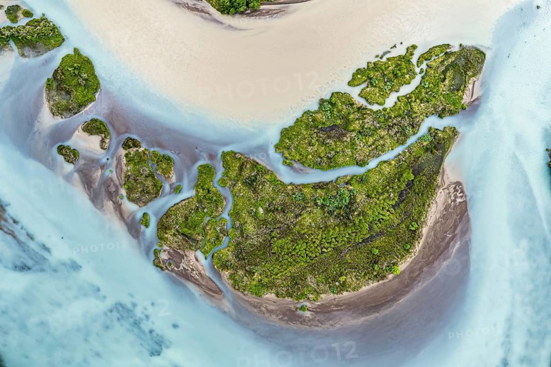 Aerial view over the branches of river Rio Ibanez, wide river landscape, muddy and blue glacial water, viewpoint Mirador Confluencia, west of Villa Cerro Castillo, Aysen, Chile