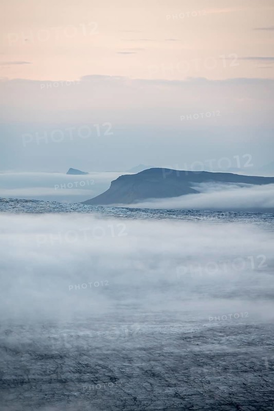 Fog over the glacier ice of Myrdalsjökull glacier, at sunset, Pakgil, Iceland