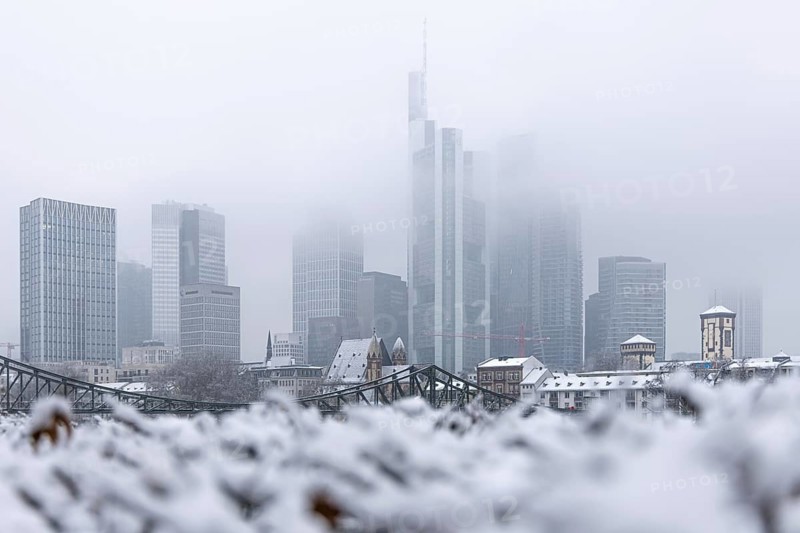 Clouds envelop Frankfurt's banking skyline. Heavy snowfalls have caused another onset of winter in the Main metropolis, Osthafen, Frankfurt am Main, Hesse, Germany