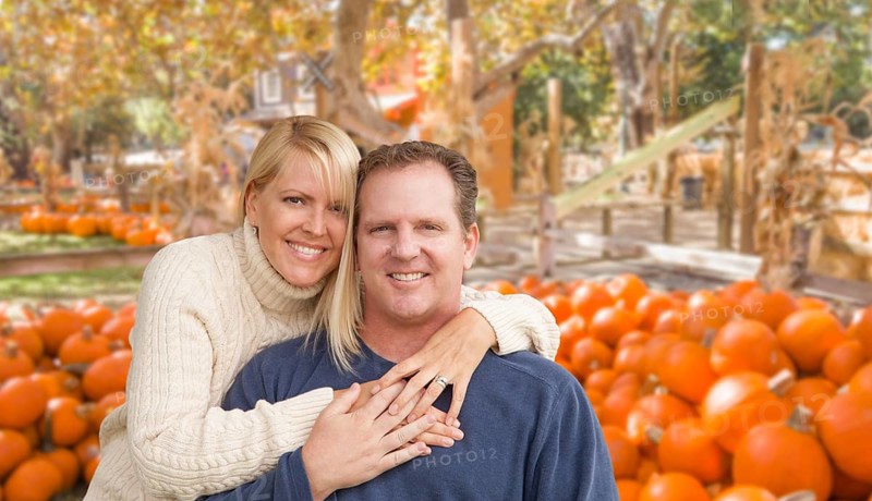 Happy Caucasian Young Adult Couple at the Pumpkin Patch Farm