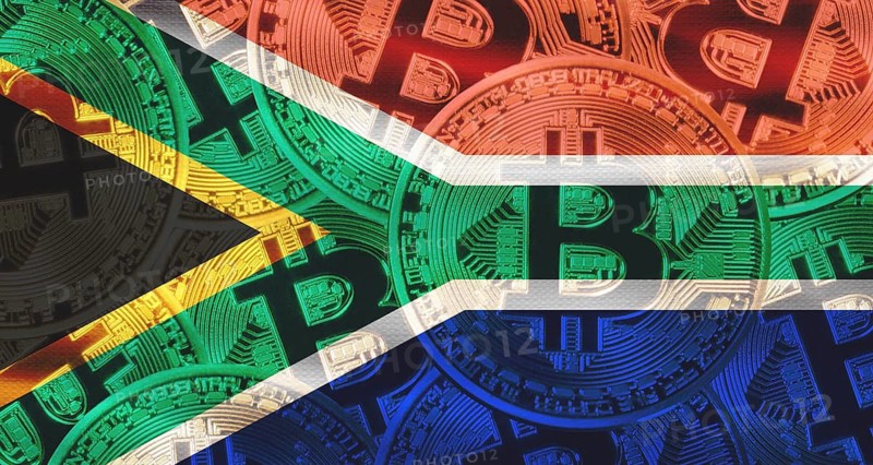 Bitcoin coins on South Africa flag background. Golden bitcoin coins on South Africa flag background