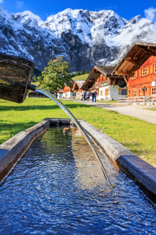 Fountain, snowy mountains, alpine pasture, autumn, maple trees, sunny, Engalm, Großer Ahornboden, Karwendel Mountains, Tyrol, Austria