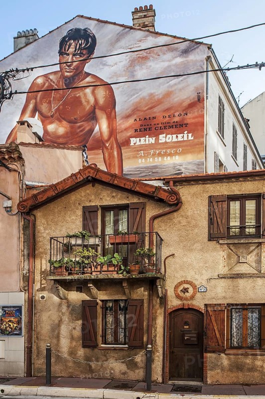 Wall painting of the French movie star Alain Delon in the film Plein Soleil by René Clément in the city Cannes, French Riviera, Provence-Alpes-Côte d'Azur, France