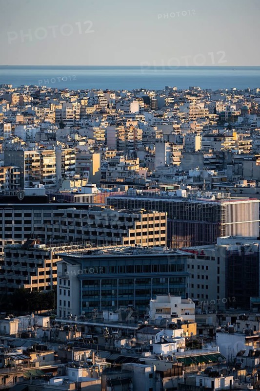 View over houses of Athens in the evening light, Athens, Attica, Greece