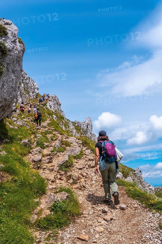 Mount Aizkorri 1523 meters, the highest in Guipuzcoa. Basque Country. A young woman reaching the top. Ascent through San Adrian and return through the Oltza fields