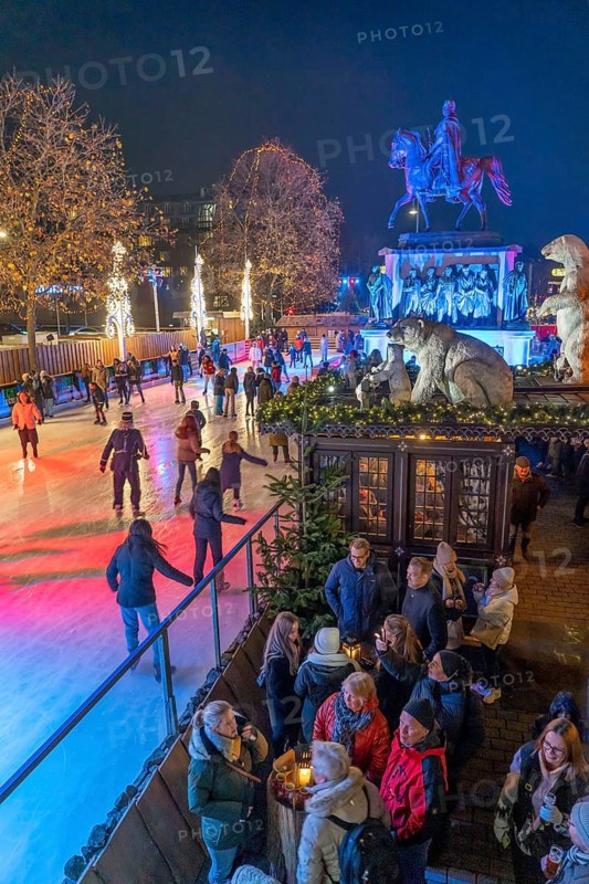 Christmas market with ice rink at Heumarkt, in the historic city centre of Cologne, North Rhine-Westphalia, Germany