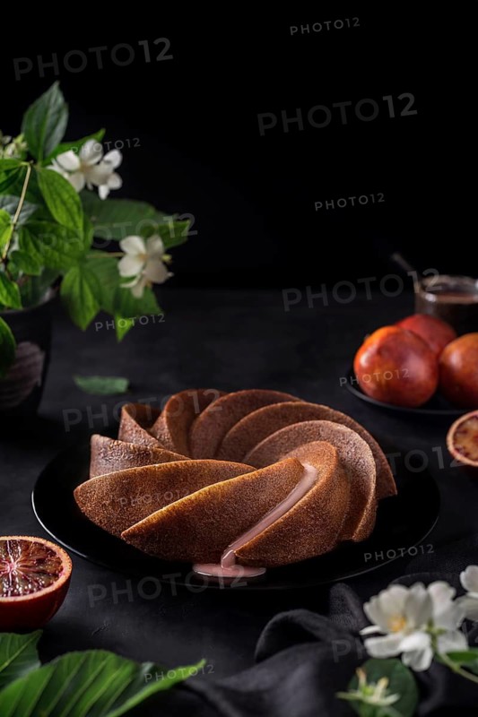 Dessert made from sanguine in a spiral shape on the table in a decorative way