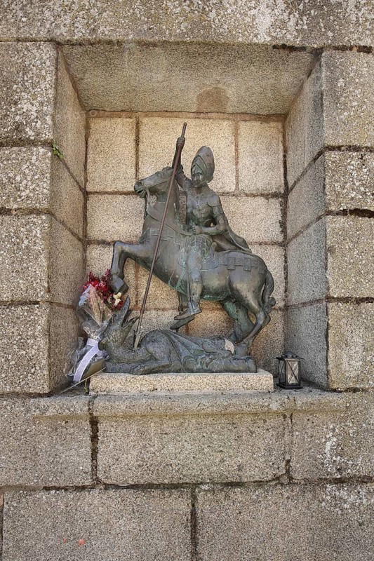 Saint George with a lance fighting dragons, bronze sculpture, Plaza de San Jorge, UNESCO old town, Caceres, Extremadura