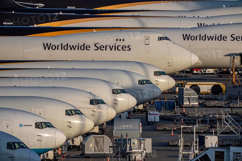Cologne-Bonn airport, CGN, air freight center, UPS logisic hub, UPS cargo aircraft on the apron, at the logistics center, Boeing 747 freighter in the back
