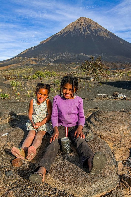 Smiling children in front of vulcano on Fogo. Cabo Verde. Africa