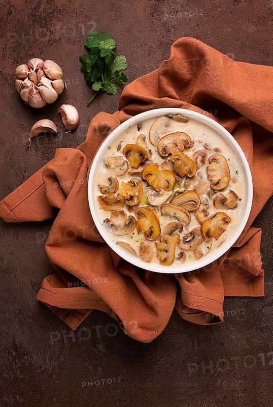 Champignons in creamy garlic sauce, with herbs and spices, gravy, sauce, no people