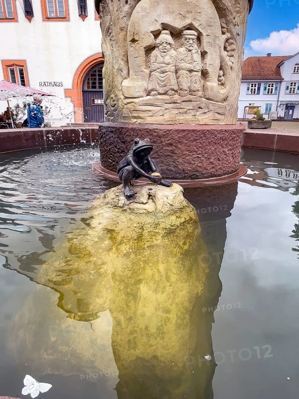 Figure of Frog King with golden ball in fairy tale fountain, Steinau an der Straße, Hesse, Germany