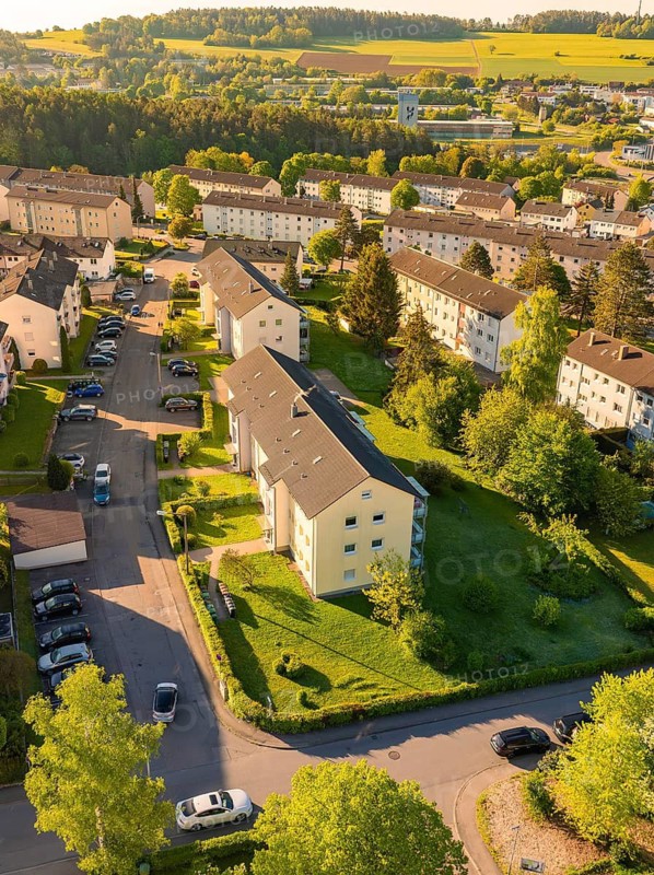 Housing estate with apartment blocks, gardens and parked cars nearby, Calw, Black Forest, Germany