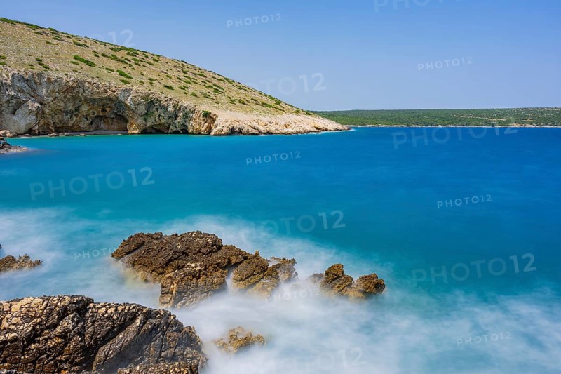 Romantic view over the sea in Koromacna Bay on a sunny day with rough seas on the island of Cres, long exposure, Croatia