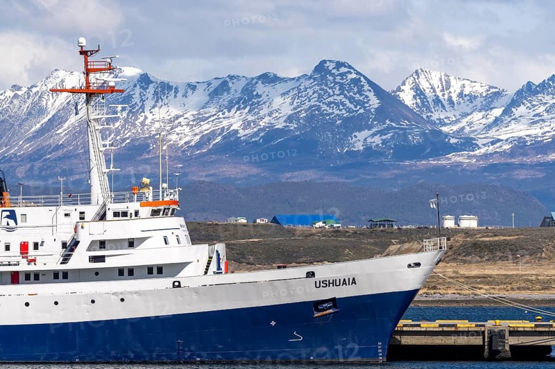 Expedition ship Ushuaia at the pier, snow-capped Andean mountains in the background, Ushuaia harbour, Tierra del Fuego, Argentina