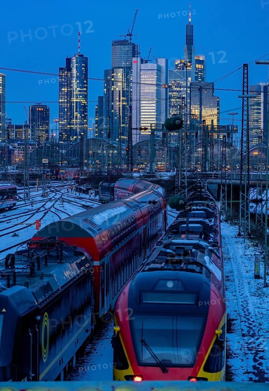 Railway tracks in front of the main railway station in Frankfurt am Main, skyline of skyscrapers in the Cit, winter, snow, dusk, Hesse, North Rhine-Westphalia