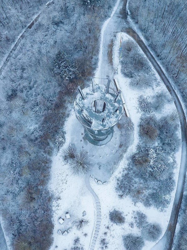 Bird's eye view of the tower, surrounded by snow and forests, cold winter ambience, Schönbuchturm, Herrenberg, Germany