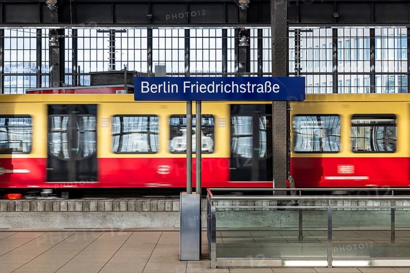 Friedrichstraße railway station in Berlin. Platform with S-Bahn and station sign. Berlin, Germany