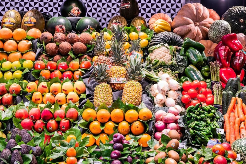 Fresh fruit and vegetables at a market stall at the Mercado de la Boqueria, the famous market on the Ramblas in Barcelona, Spain