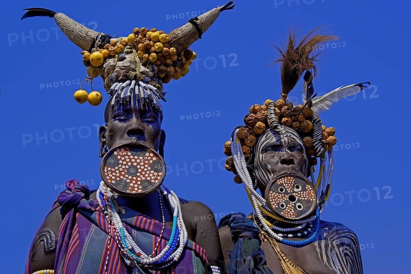 Ethiopia, woman, two woman, Mursi, lip plate, jewelry scars