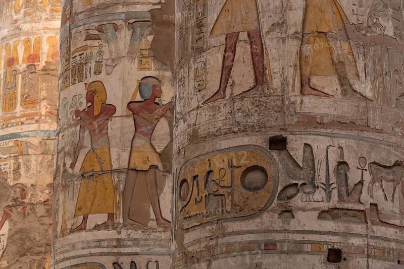 Ancient Egyptian Pharaonic Hieroglyphic relief details on columns of the Great Hypostyle Hall of the Temple of Karnak, Luxor, Egypt