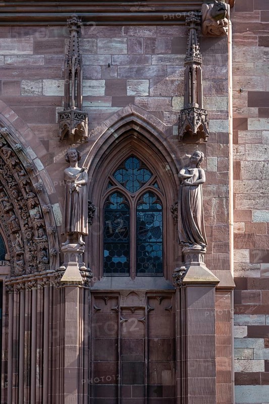 Detailed view of Basel Cathedral with the seducer and the foolish virgin statues, Old Town, Basel, Canton of Basel-City, Switzerland