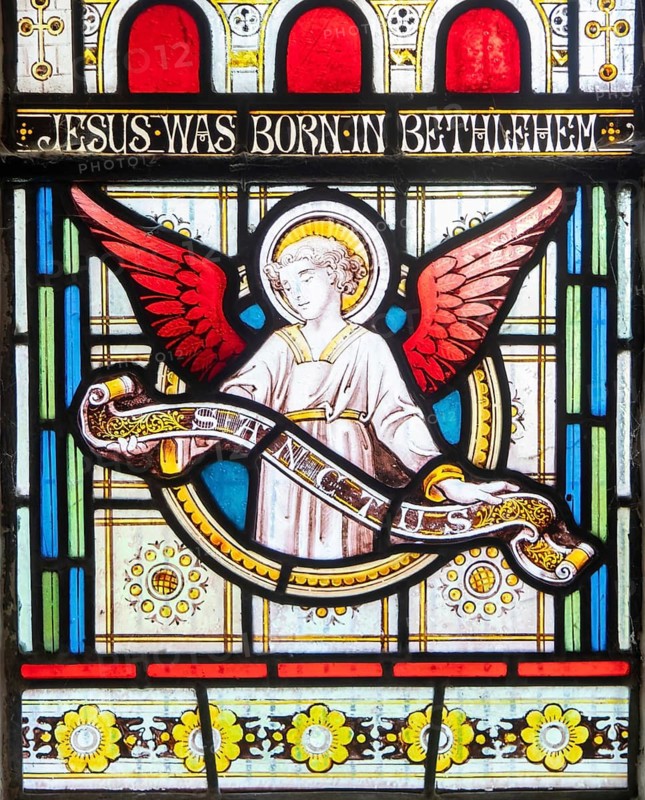 Details of stained glass window of an angel by Clayton and Bell, church of Saint James, Avebury, Wiltshire, England, UK