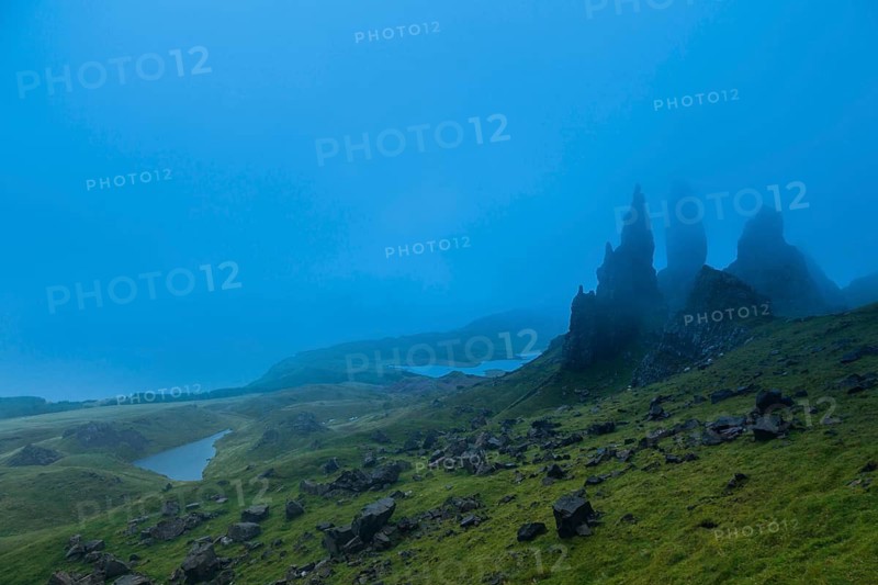 UK. Scotland. Isle of Skye. The Old Man of Storr covered in mist during a storm