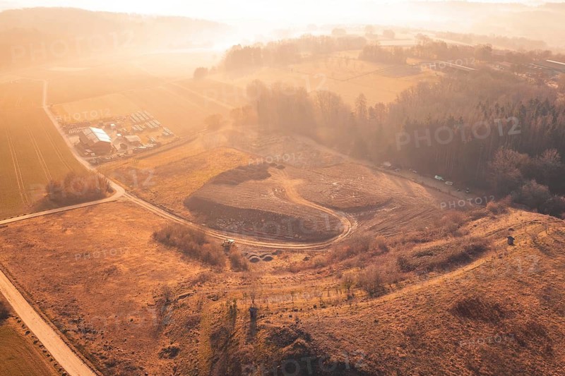 Wide, hilly landscape with fields and trees in soft morning light from the air, landfill, Gechingen, Calw district, Germany