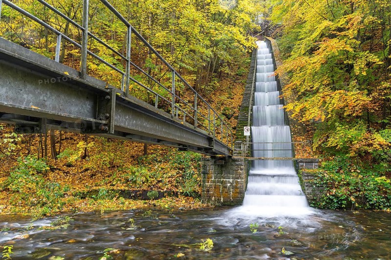 Cascade for power generation at the Rabenauer Grund hydroelectric power plant in autumn, Rote Weisseritz valley, Freital, Saxony, Germany
