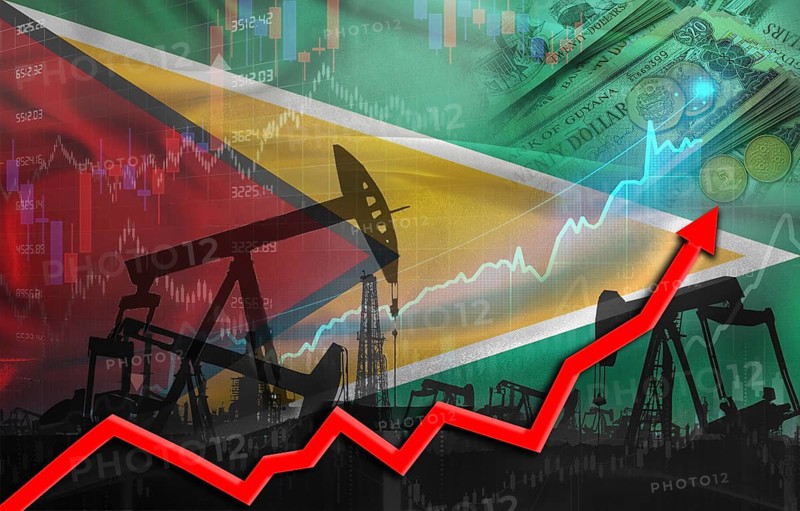 Oil production with Guyanese flag, petrol industry. Oil pumps with Guyana flag