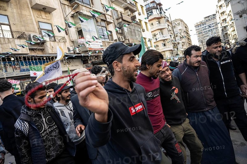 Damascus, Syria. December 7th 2025. Syrians dance the traditional dabke to celebrate one year since the fall of the Assad regime, Damascus, Syria