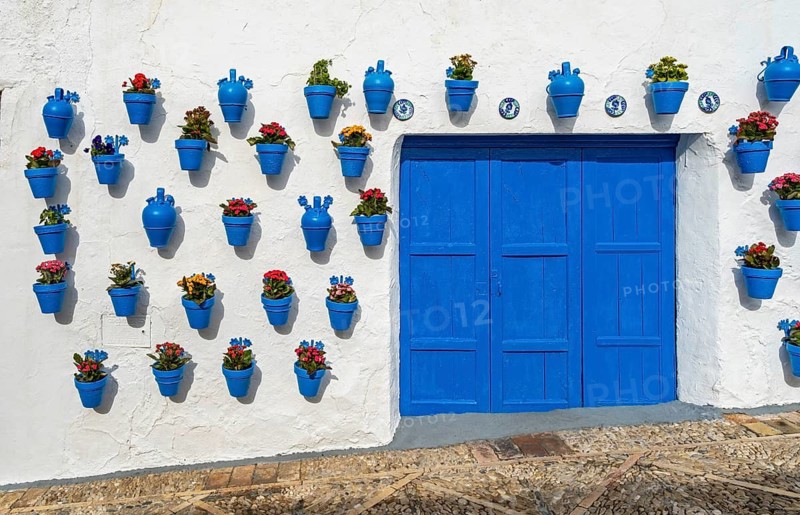 Blue flower pots on whitewashed wall, Castle of Iznajar, Castillo de Iznájar, Andalusia, Spain