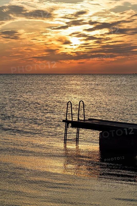 Seaside jetty, bathing spot, sunset, back light, Baltic Sea, Burgsvik, Gotland island, Sweden